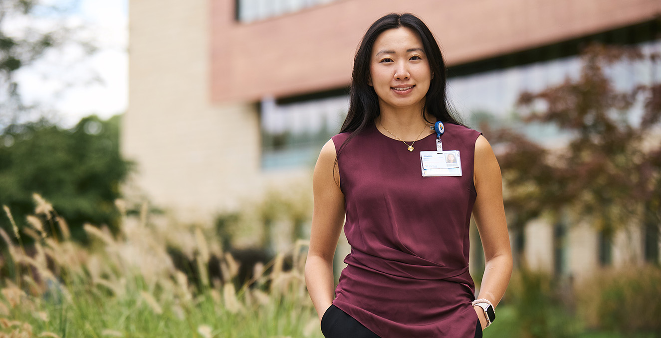 Rowan-Virtua SOM student smiles at the camera while standing outside Virtua Voorhees hospital
