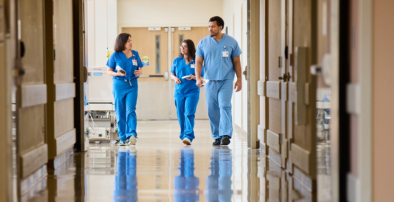 Rowan-Virtua SOM students and a Virtua physician walk through the Virtua Voorhees hospital
