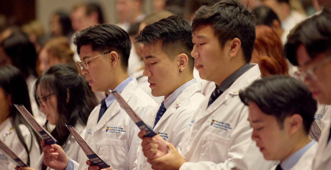 medical students recite the oath during the whitecoat ceremony