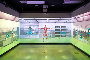 the augmented reality room features a detailed human body, as well as other realistic features projected on the walls of the room