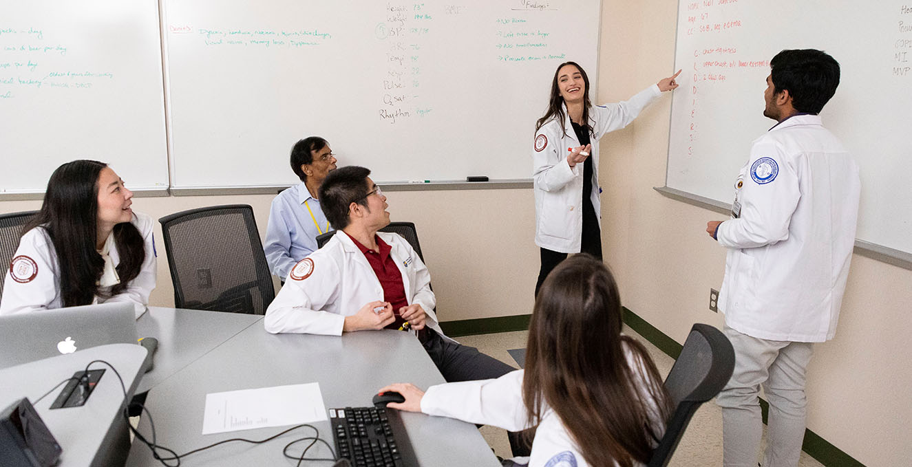 students and faculty discuss a case in a PBL class