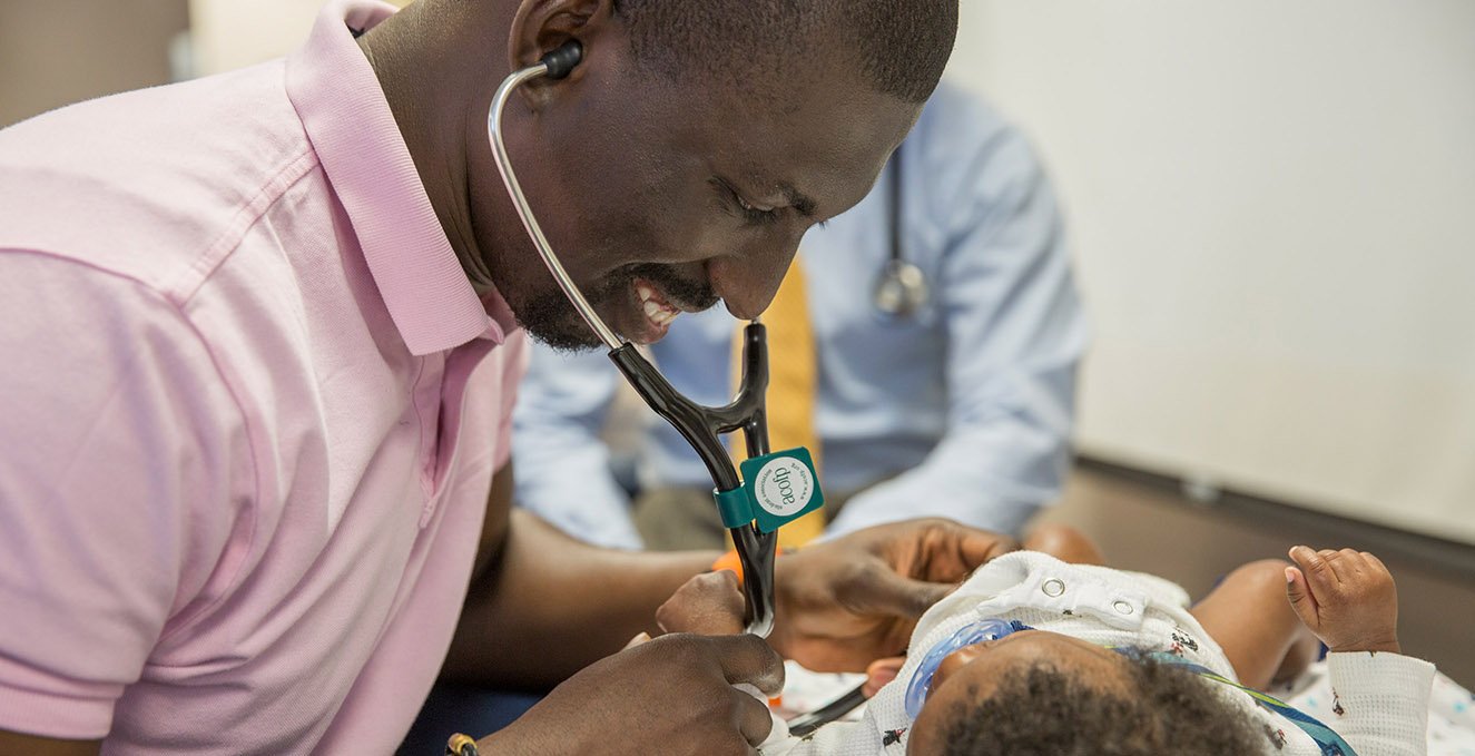 A resident looks over a pediatric patient