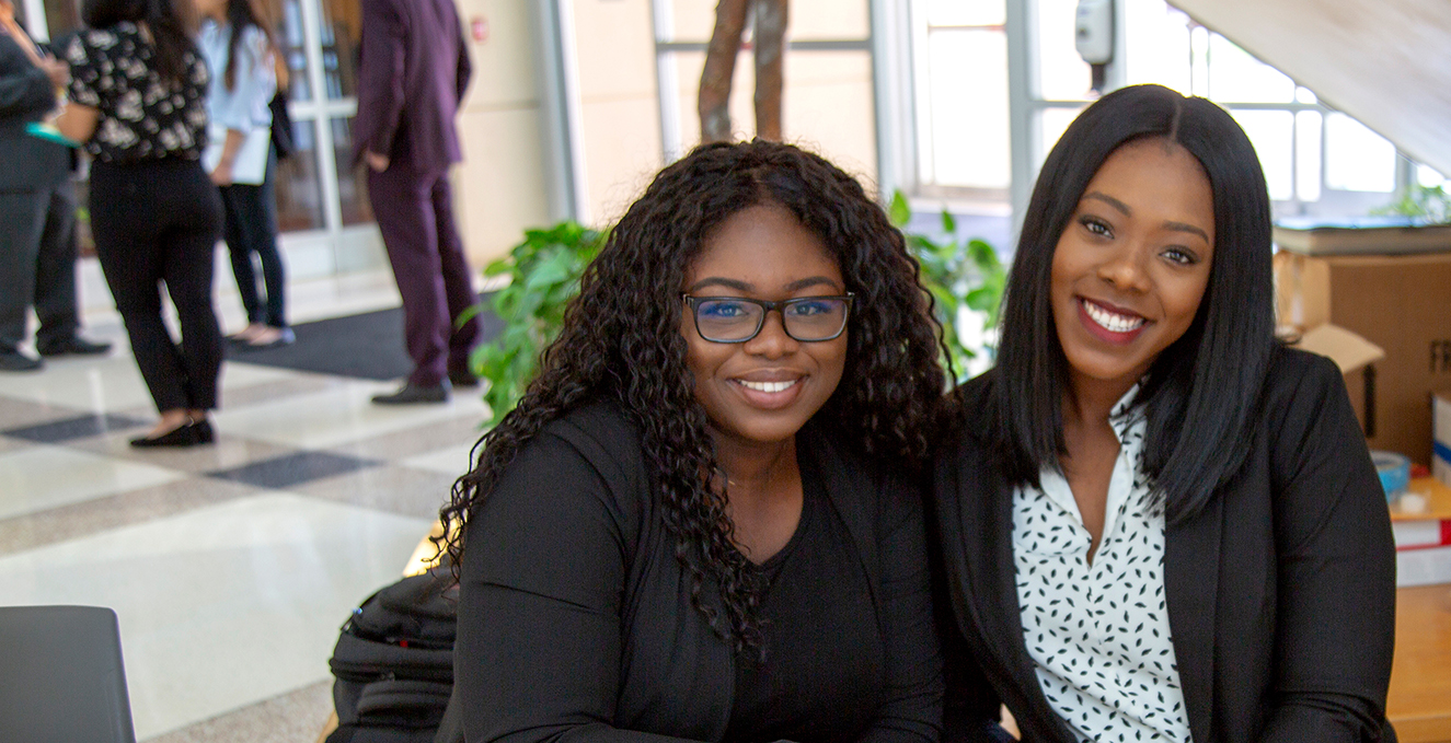 SOM staff smiling in the Academic Center