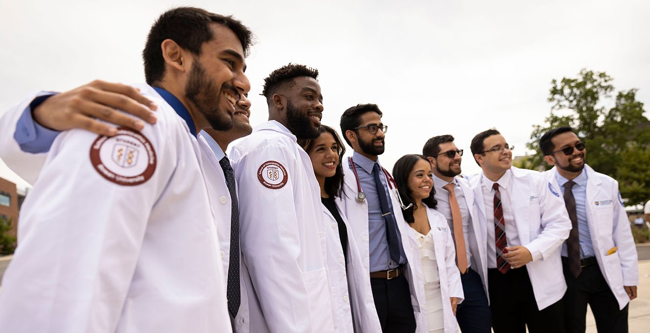 smiling students at the white coat ceremony