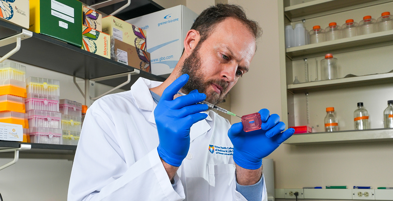 Researcher Brian Weiser prepares a substance for an experiment