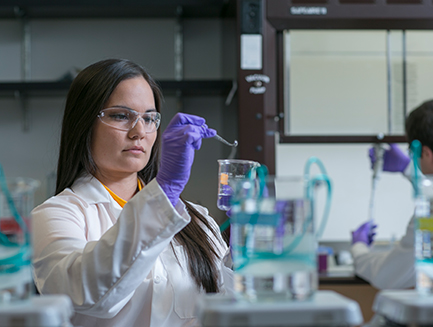 a student works at a lab table