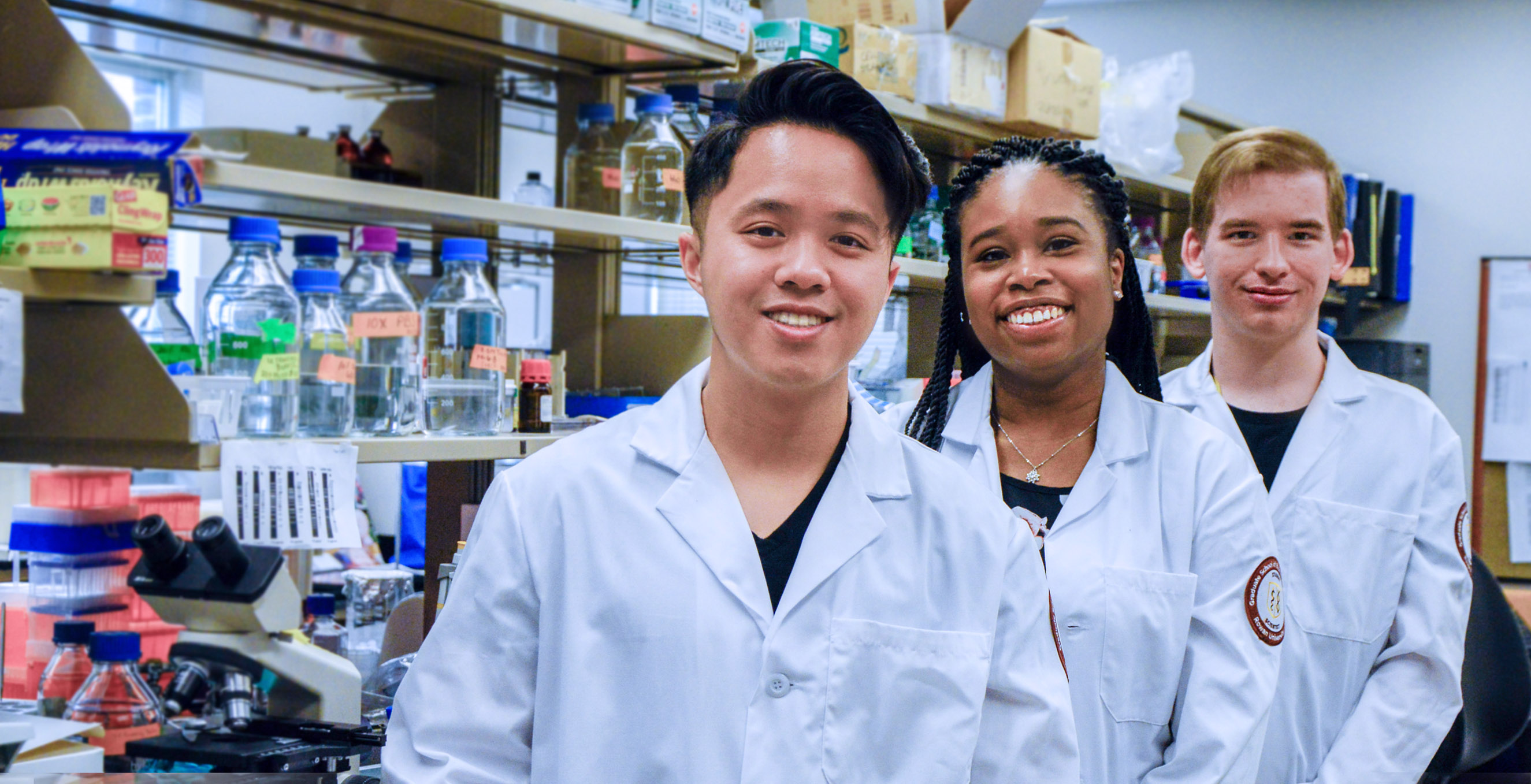 three research students in the lab